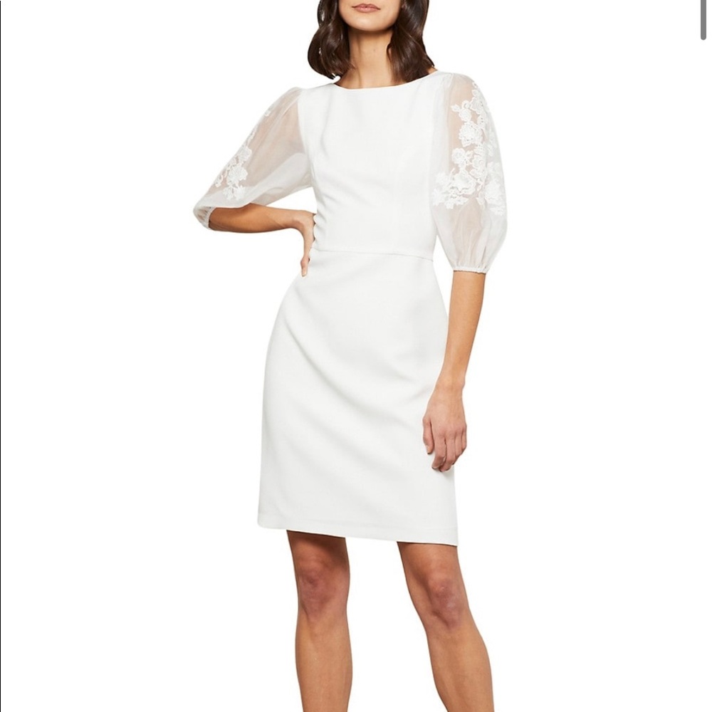 I’m selling an off-white lace puff-sleeve satin crepe dress